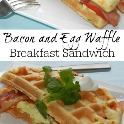 Rectangular white plate with a bacon and egg waffle breakfast sandwich and fork