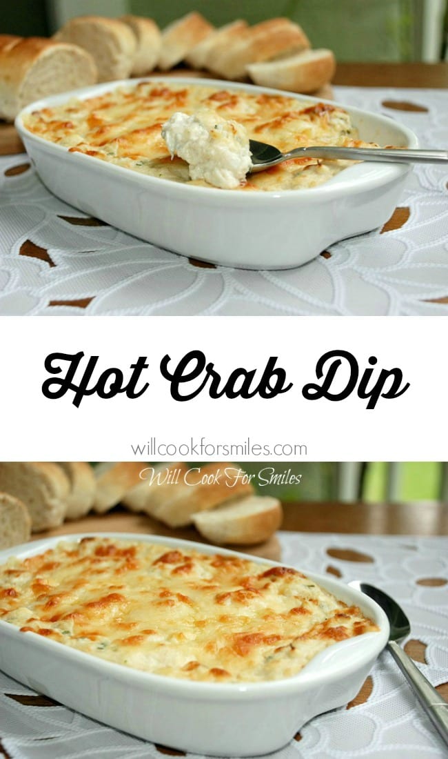 Hot crab dip in a white casserole dish with a spoon scooping some out