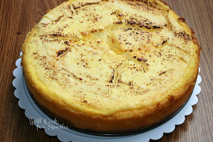 Creme Brulee Layered Cheesecake on a cake stand 