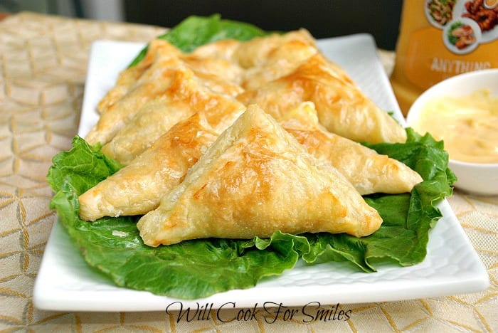 chicken pockets on a bed of lettuce on a white plate 