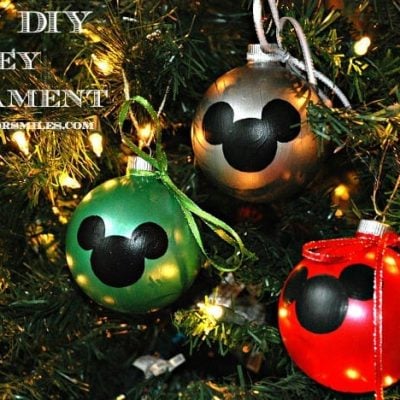 3 DIY mickey mouse ornaments on a lit christmas tree