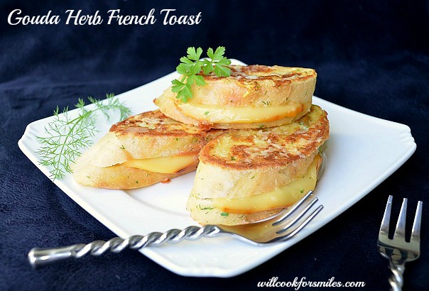 Gouda Herb Savory French Toast stacked on a plate with a fork 