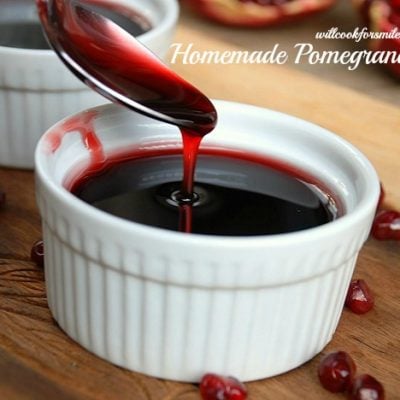 Cup of pomegrantae syrup with spoon