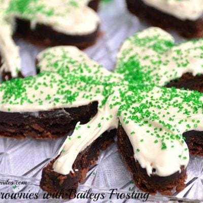 close up view of st patty's day cookies shaped as 3 leaf clovers