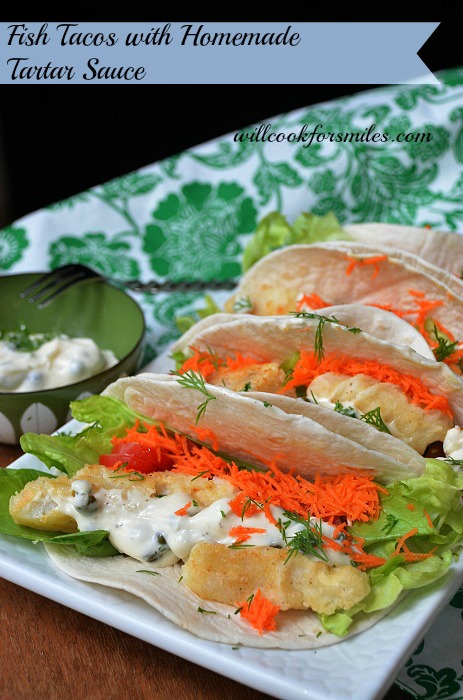 Fish tacos with homemade on a plate with tartar sauce in a bowl 
