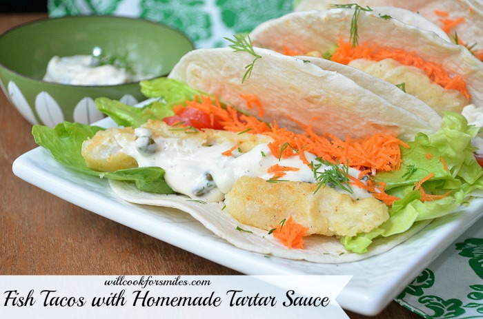 Fish tacos with homemade on a plate with tartar sauce in a bowl 