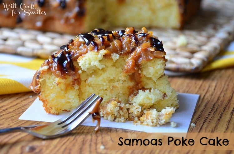 Samoas Poke Cake slice on a napkin close up to the left