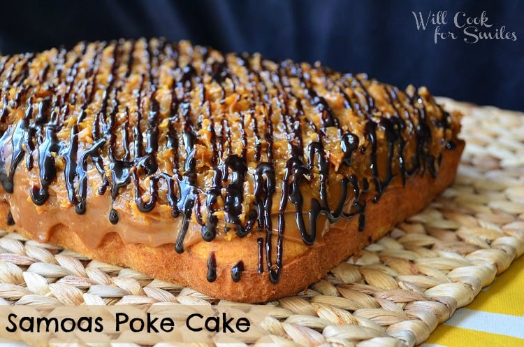 entire samoas poke cake shot from slightly above on wicker placematt.