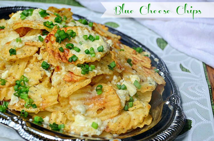 shot from above silver platter with blue cheese chips on a white and green cloth slight angle to the left