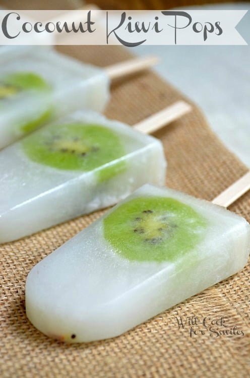 Coconut Kiwi Pops with Kiwi frozen in the middle on a burlap table runner 
