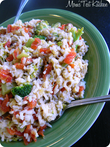 Chicken Bacon Rice with red peppers and broccoli on a green plate 