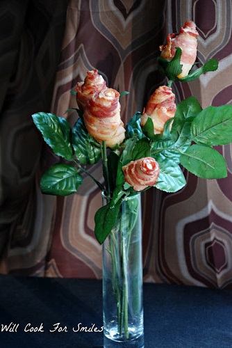 front shot of edible flowers made of bacon in a clear glass vase