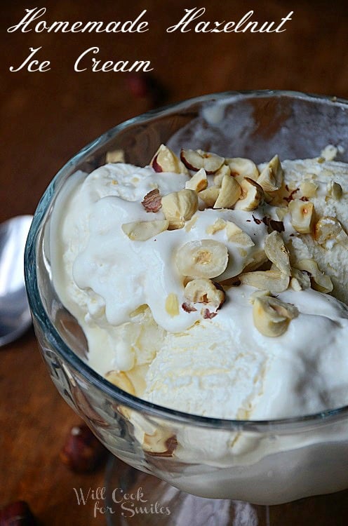 shot from above clear glass bowl filled with ice cream and spoon with ice cream being removed