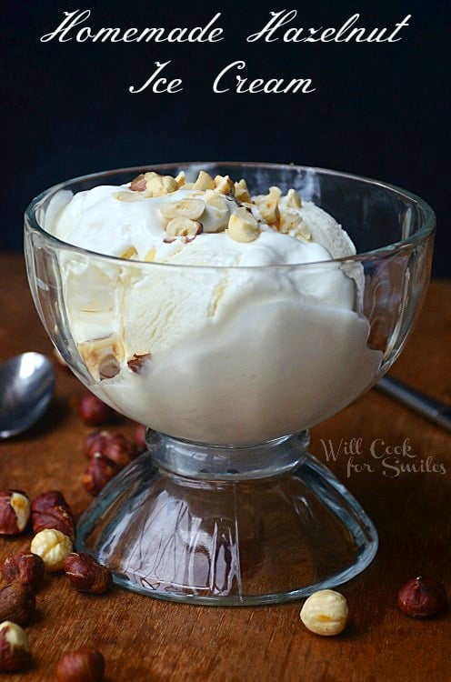 Homemade Hazelnut Ice Cream in a glass bowl with hazelnuts on top 