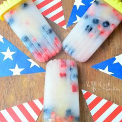 red white and blue pops shot from above with american flags pointing to center