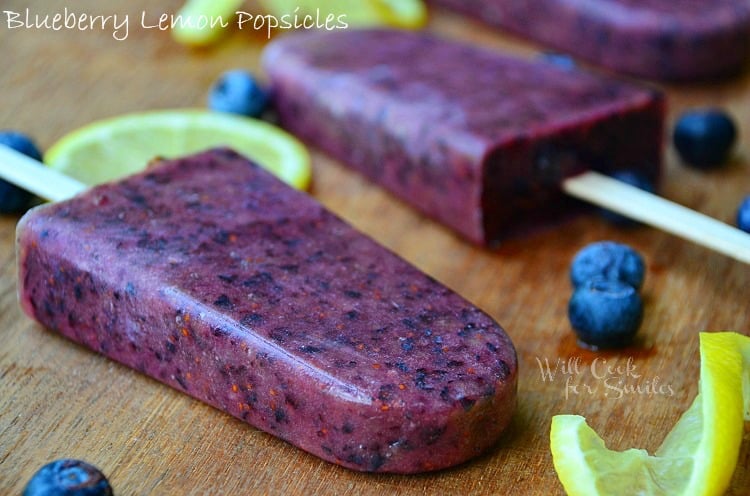 Blueberry Lemon Popsicles on a cutting board 
