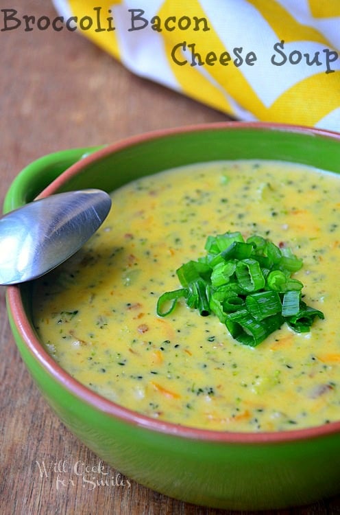 Easy Broccoli Cheese Soup Recipe in a bowl with a spoon leaning on the bowl sitting on a table
