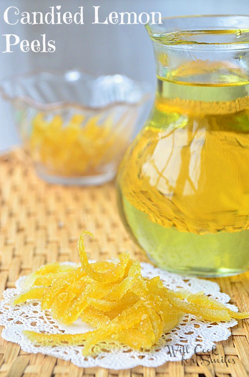 Candied lemon peels on a lace napkin. With some lemon syrup to the right 