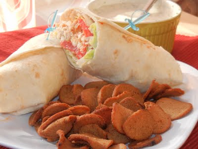 buffalo chicken wrap on a plate with bagel chips 