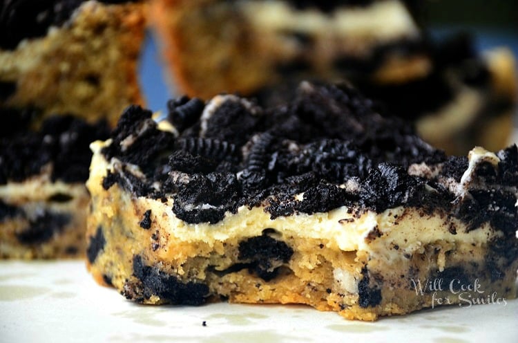 Oreo Cheesecake cookie bars slice with a bite out of it 