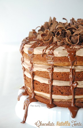 Chocolate Nutella Torte cake on a white cake stand 