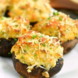 closeup of stuffed mushrooms on a white plate