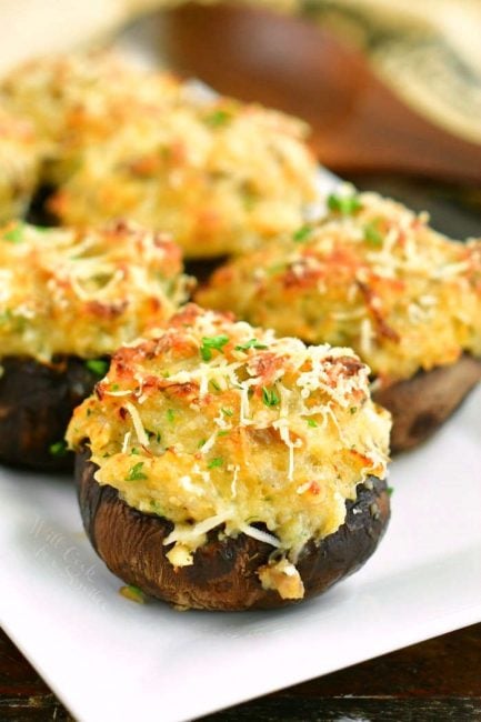 closeup of stuffed mushrooms on a white plate