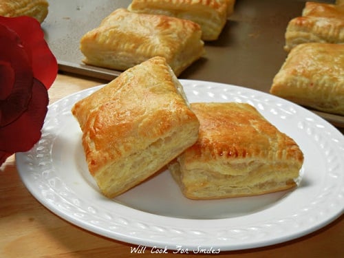 cranberry brie puffs on a white plate 