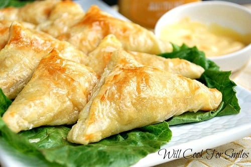 Honey Dijon Chicken Pockets on a bed of lettuce on a white plate 