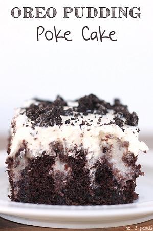 oreo pudding poke cake slice on a white plate 