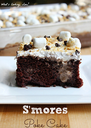 S'mores Poke Cake slice on a white plate 