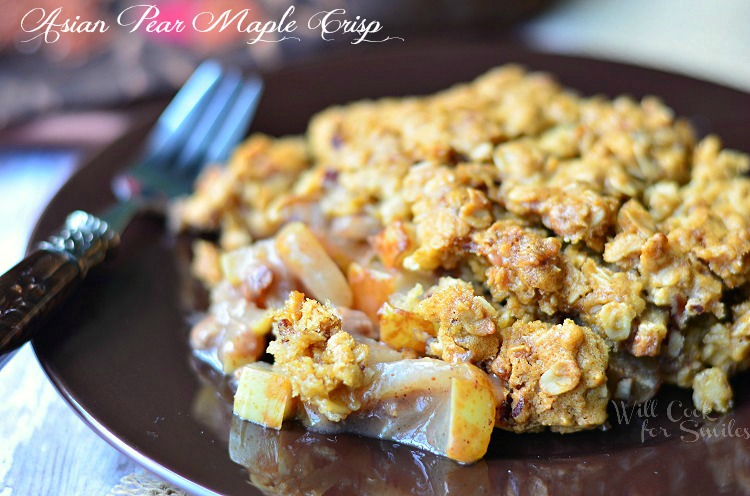 Asian Pear Crisp on a brown plate with a fork to the left 