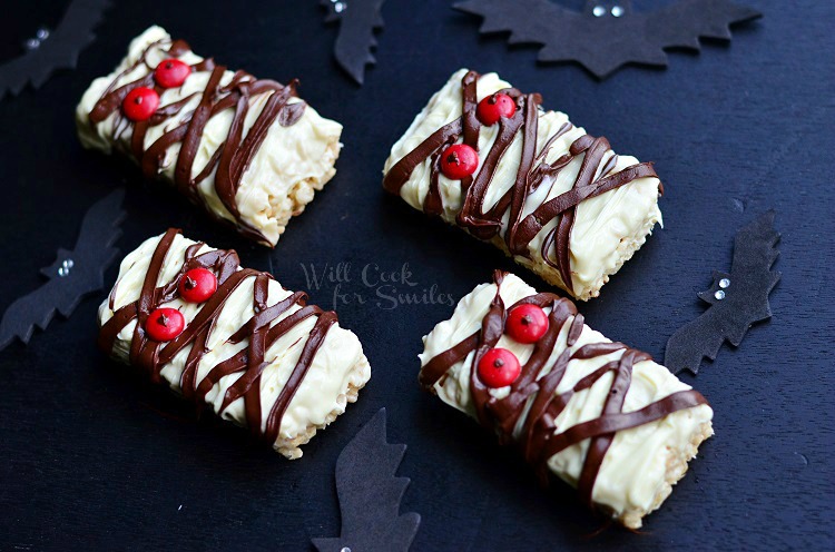 Rice Krispie Mummies with chocolate drizzle and red candy eyes 