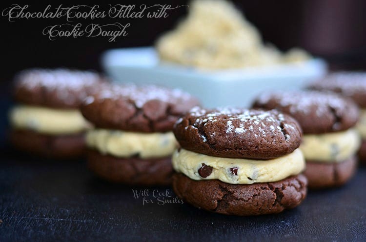 chocolate cookie sandwich with Cookie Dough Filling stacked up on a table 