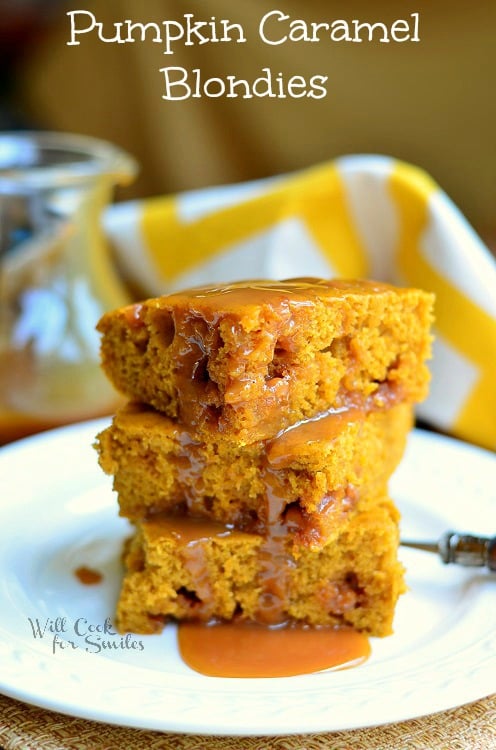 Pumpkin Caramel Blondies stacked on a plate with caramel over them 