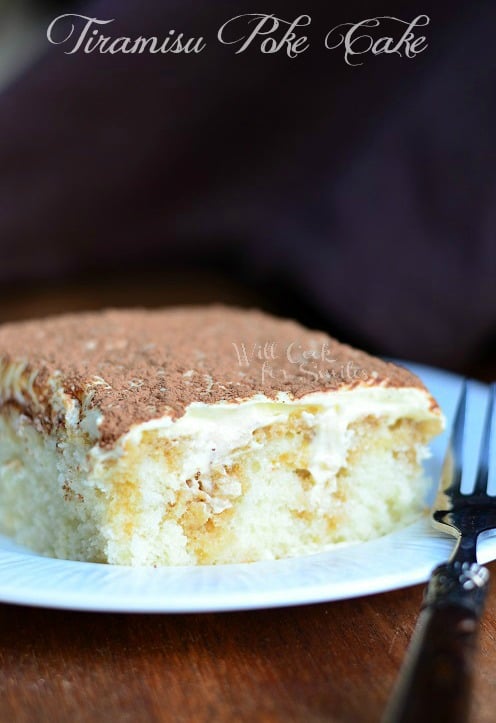 Tiramisu Poke Cake slice on a plate with a fork to the right 
