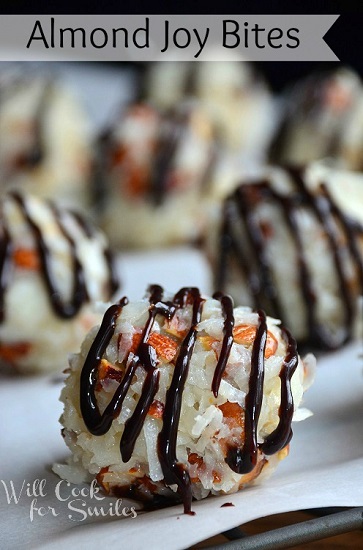 Almond joy bites with chocolate drizzled on top on a sheet of wax paper 