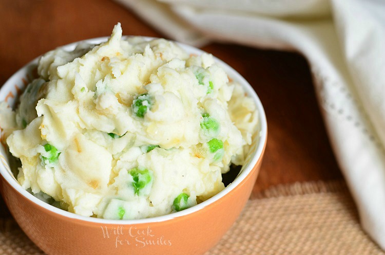 Perfect Mashed Potatoes with Peas and Caramelized Onions in a bowl 