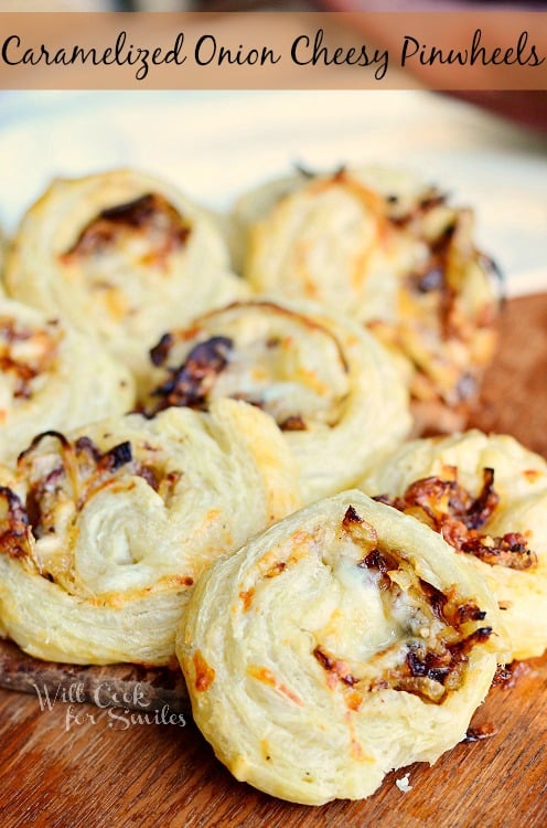 Caramelized Onion Cheesy Pinwheels on a cutting board 