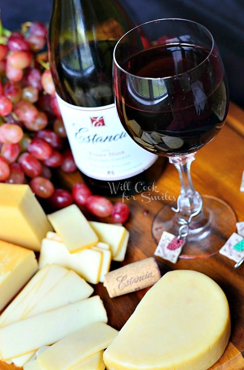 Pairing Wine and Cheese on a cutting board 