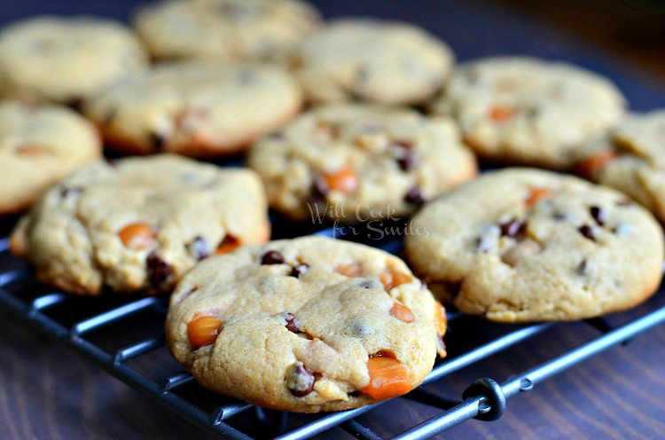 horizonal photo Sumbitches Peanut Butter Chocolate Caramel Cookies on a cooling rack 