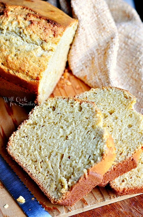 Vanilla Bean Eggnog Bread slices on a wood cutting board 