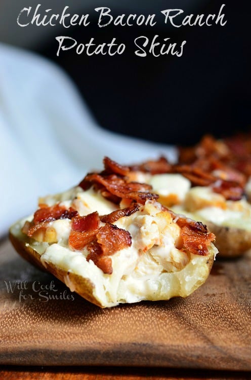 Chicken Bacon Ranch Loaded Potato Skins on a wood cutting board 