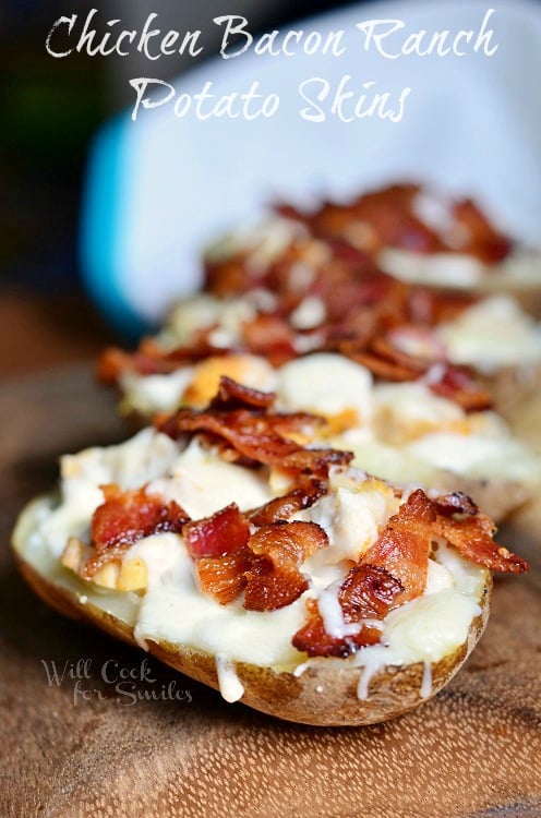 Chicken Bacon Ranch Loaded Potato Skins on a wood cutting board 
