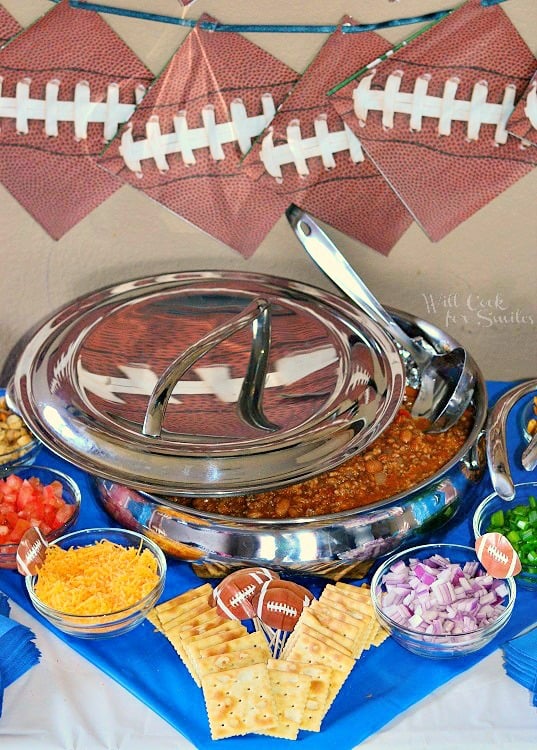 Chili Bar with chili in a big pot with a lid and all the sides around it 