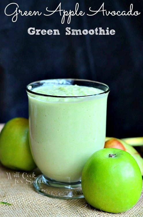 Green Apple Avocado Green Smoothie with apples next to the outside of the glass 