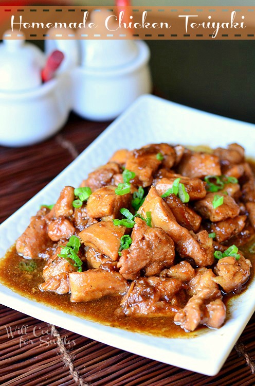 Chicken Teriyaki on a white plate with green onions sliced on top 