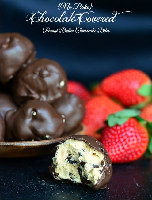 (No Bake) Chocolate Covered Peanut Butter Cheesecake Bites with a bite out of one 