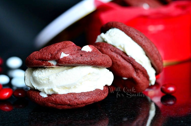 Red Velvet Ice Cream Sandwich Cookies on a black counter top 