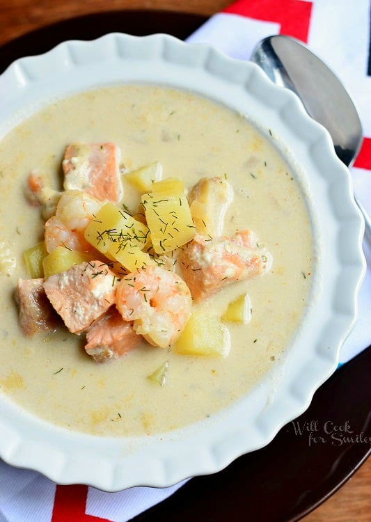 close up of Seafood Chowder Soup in a white bowl 